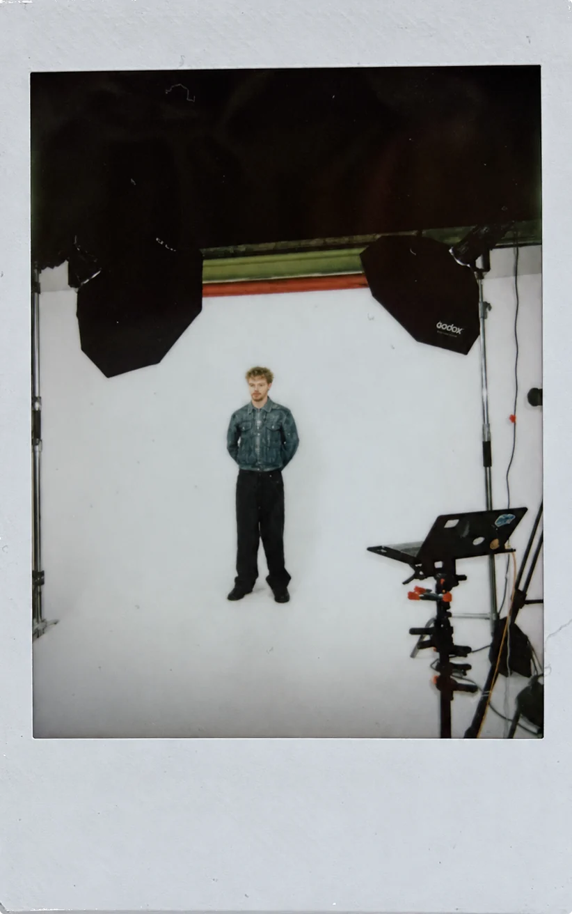 Polaroid of Dylan in a photo studio